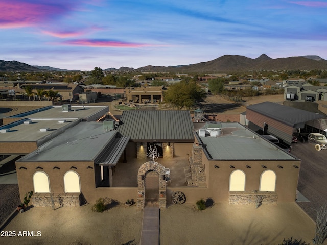 aerial view at dusk with a mountain view