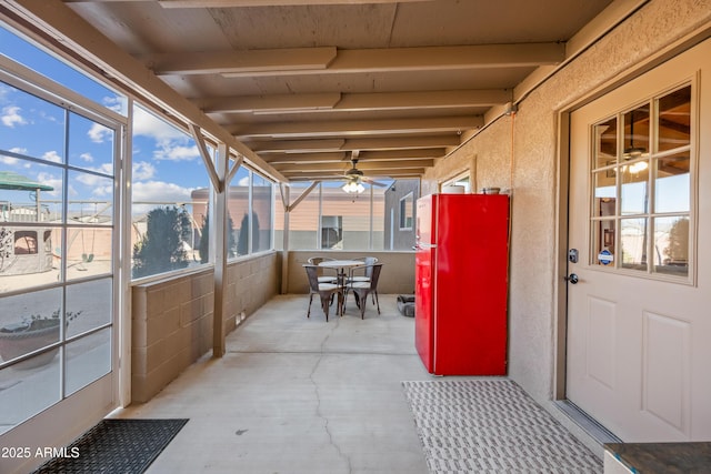 sunroom / solarium with ceiling fan