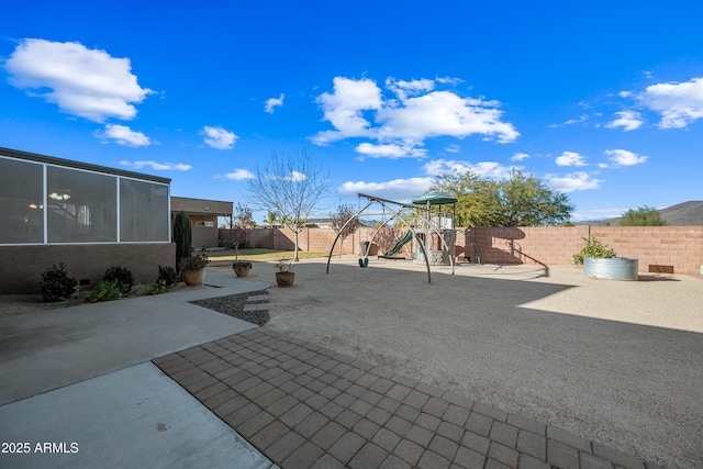 view of patio featuring a playground