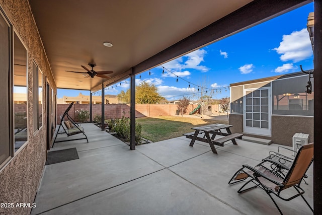 view of patio / terrace featuring ceiling fan