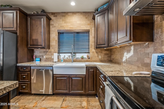 kitchen featuring dark brown cabinetry, extractor fan, stainless steel appliances, and sink