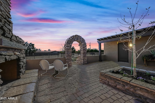 view of patio terrace at dusk