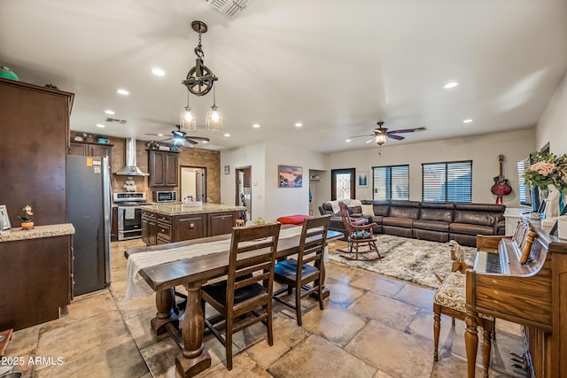 dining space featuring ceiling fan