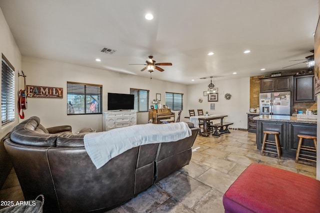 living room featuring ceiling fan