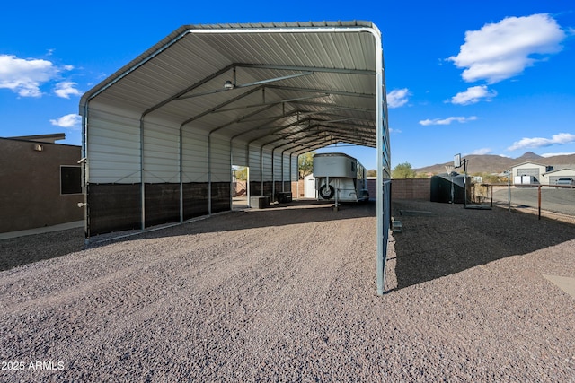 view of vehicle parking with a carport