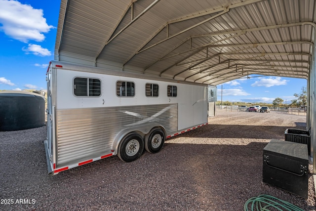 view of parking / parking lot featuring a carport