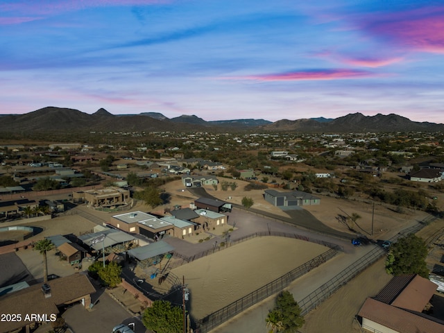 aerial view at dusk featuring a mountain view