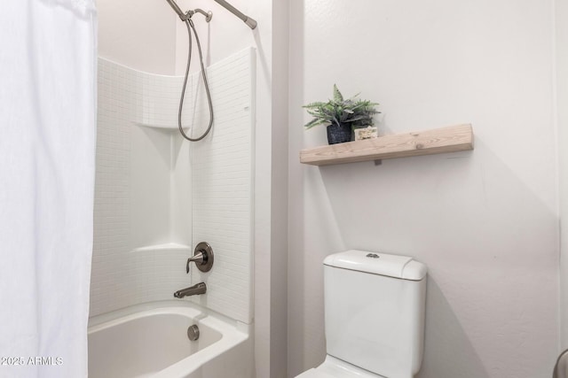 full bathroom with toilet and shower / bath combo with shower curtain