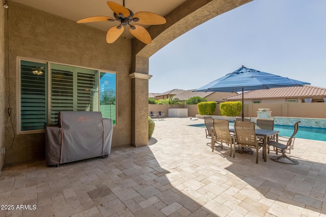 view of patio / terrace with a grill, fence, ceiling fan, and a fenced in pool