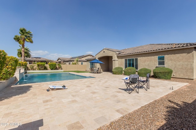 view of swimming pool featuring a patio, a fenced backyard, and a fenced in pool