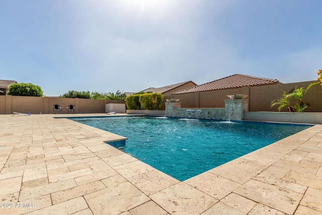 view of swimming pool featuring a fenced in pool, a fenced backyard, and a patio