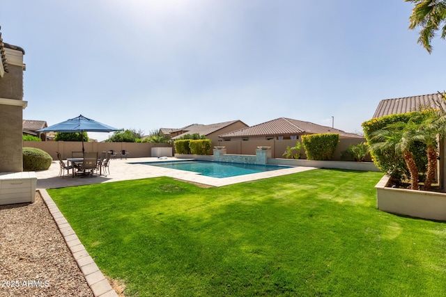 view of pool featuring a patio area, a fenced backyard, and a lawn