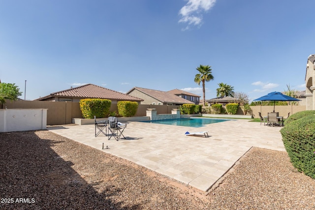 view of swimming pool with a fenced in pool, a patio area, and a fenced backyard