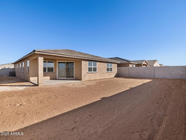 back of house featuring a patio area