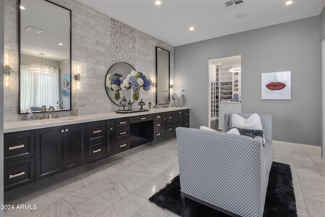 bathroom featuring vanity and a chandelier