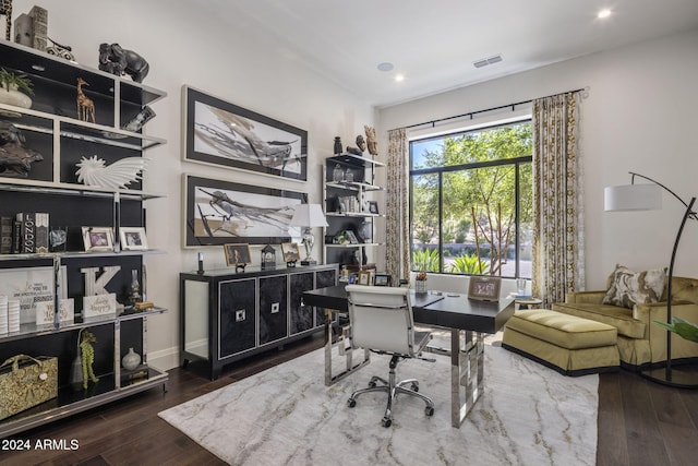 office space with dark wood-type flooring