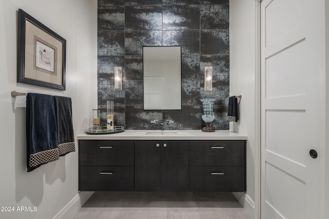 bathroom featuring tile walls, vanity, backsplash, and tile patterned floors