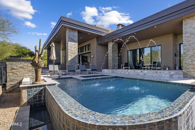 view of pool featuring a patio and pool water feature