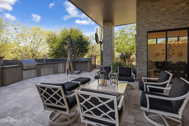 view of patio / terrace featuring area for grilling, an outdoor living space, and a grill