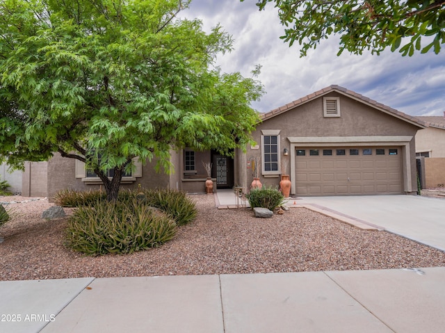 22986 S 208th St, Queen Creek, AZ 85142 - view of front facade featuring an attached garage, stucco siding, and driveway