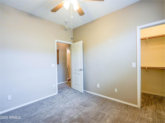 22986 S 208th St, Queen Creek, AZ 85142 - unfurnished bedroom featuring a walk in closet, carpet floors, baseboards, a closet, and a ceiling fan