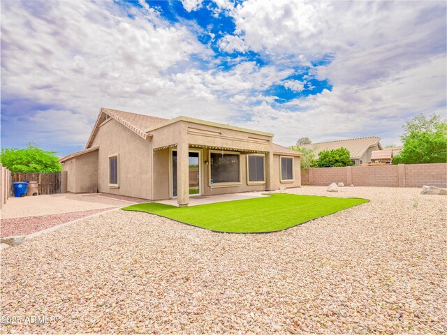 22986 S 208th St, Queen Creek, AZ 85142 - back of property featuring stucco siding, a fenced backyard, and a patio