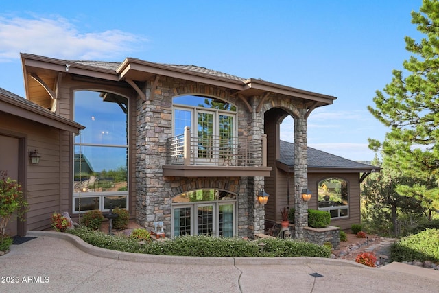 2800 E Morning Glory Cir, Payson, AZ 85541 - rear view of property with a balcony and stone siding