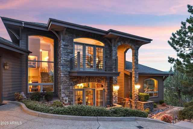 2800 E Morning Glory Cir, Payson, AZ 85541 - back of house at dusk with a balcony and stone siding