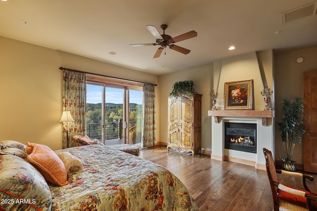 2800 E Morning Glory Cir, Payson, AZ 85541 - bedroom featuring wood-type flooring, a large fireplace, baseboards, and recessed lighting