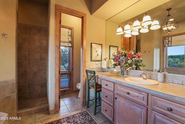 2800 E Morning Glory Cir, Payson, AZ 85541 - bathroom featuring toilet, vanity, tiled shower, tile patterned flooring, and a chandelier