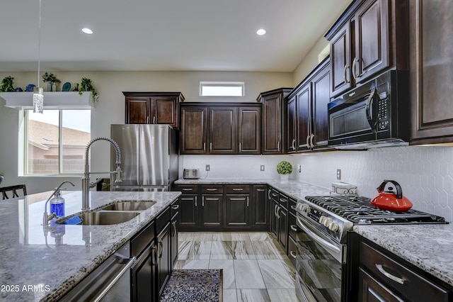6215 E Sefton Dr, Prescott Valley, AZ 86314 - kitchen with a sink, plenty of natural light, appliances with stainless steel finishes, and light stone countertops