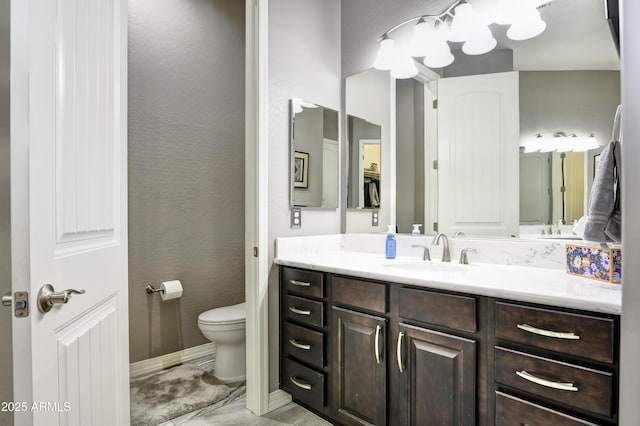 6215 E Sefton Dr, Prescott Valley, AZ 86314 - bathroom featuring a textured wall, toilet, and vanity