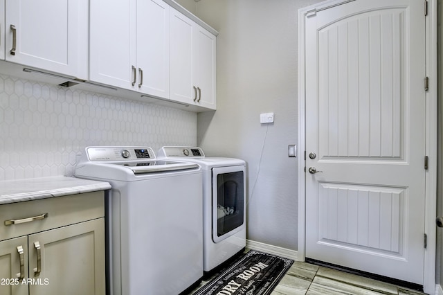 6215 E Sefton Dr, Prescott Valley, AZ 86314 - washroom featuring washing machine and clothes dryer, cabinet space, and baseboards