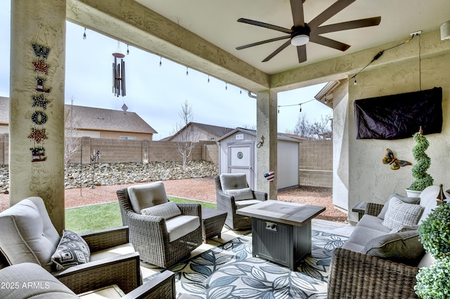 6215 E Sefton Dr, Prescott Valley, AZ 86314 - view of patio featuring an outdoor hangout area, a fenced backyard, a ceiling fan, a storage unit, and an outdoor structure