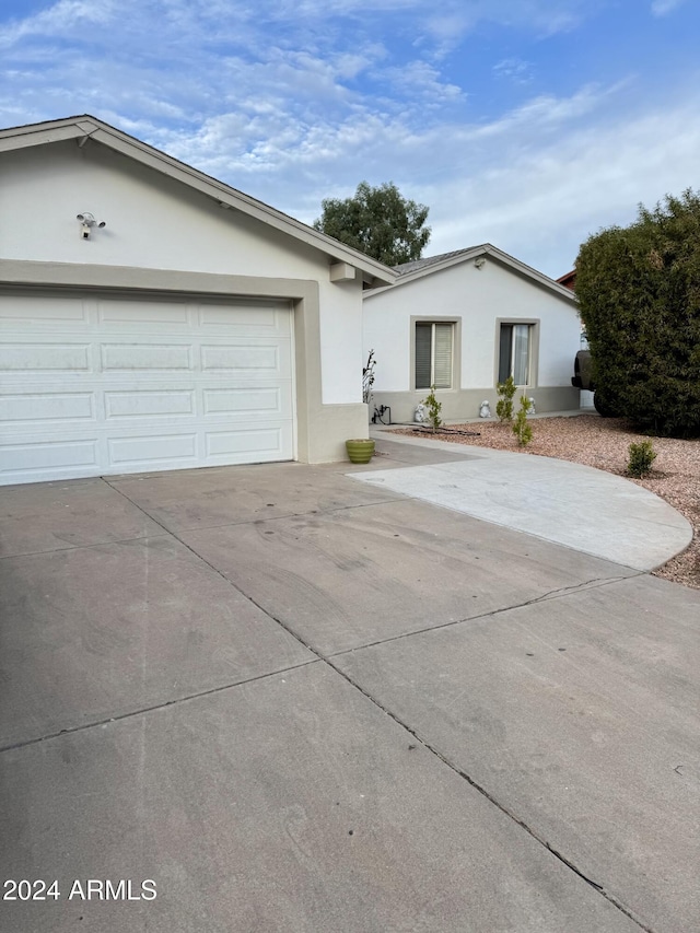 ranch-style house featuring a garage