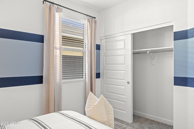 carpeted bedroom featuring a closet