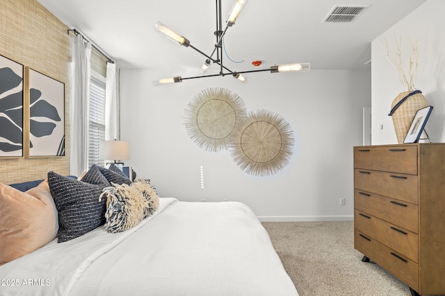 bedroom featuring light carpet and an inviting chandelier