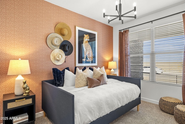 carpeted bedroom with a chandelier