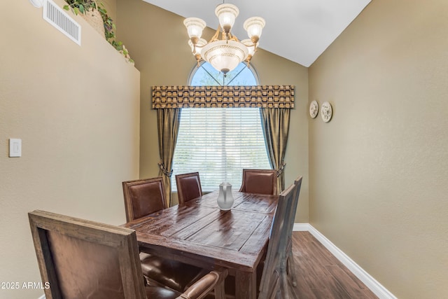 dining space featuring visible vents, an inviting chandelier, lofted ceiling, baseboards, and dark wood finished floors