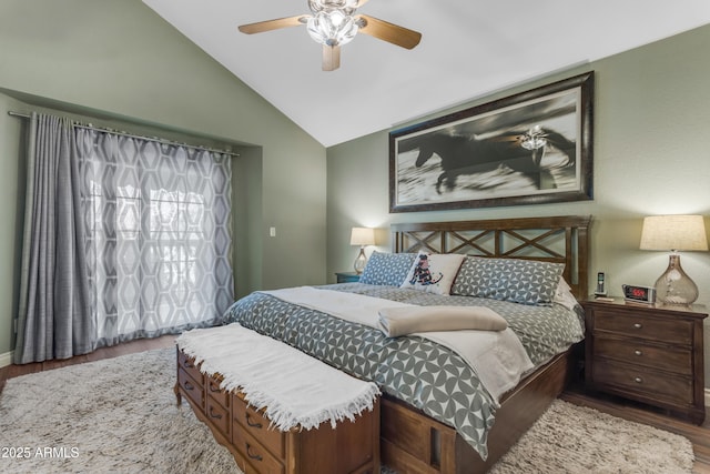 bedroom featuring a ceiling fan, wood finished floors, and lofted ceiling