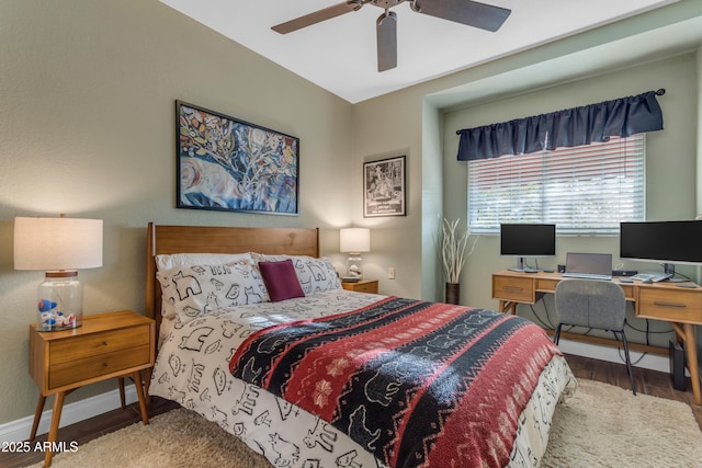 bedroom featuring baseboards, ceiling fan, and wood finished floors