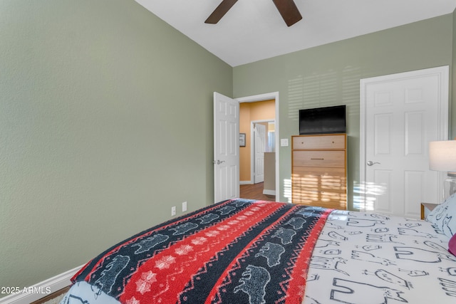 bedroom featuring baseboards and a ceiling fan