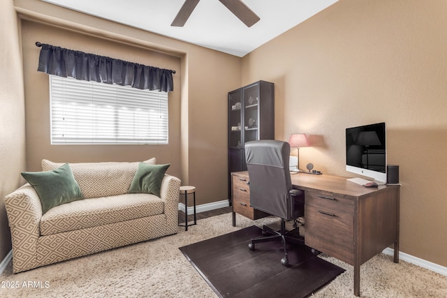 home office featuring ceiling fan and baseboards