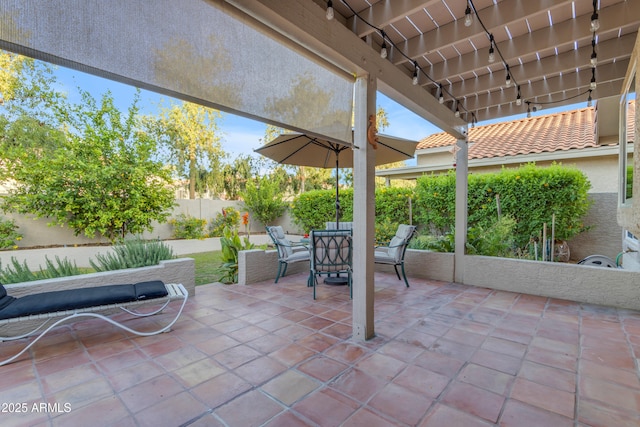 view of patio featuring outdoor dining space and a fenced backyard