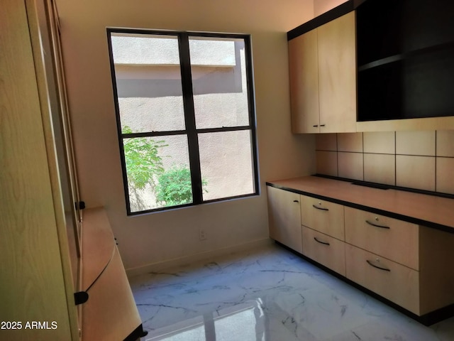 25150 N Windy Walk Dr Unit 14, Scottsdale, AZ 85255 - kitchen featuring light marble finish flooring, light brown cabinets, and modern cabinets