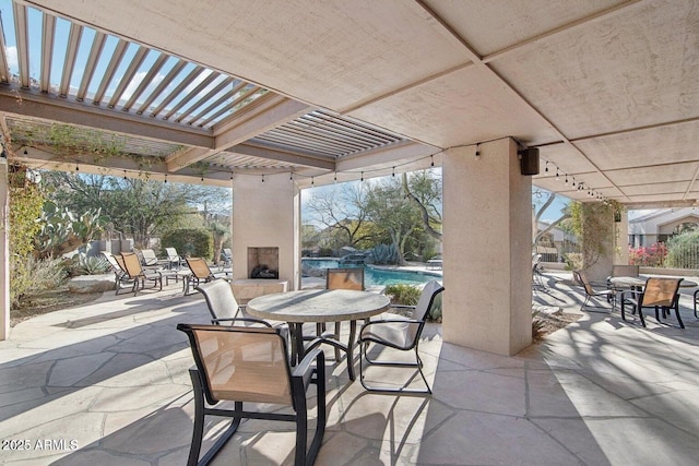 25150 N Windy Walk Dr Unit 14, Scottsdale, AZ 85255 - view of patio featuring outdoor dining space, a fireplace, a pergola, and an outdoor pool