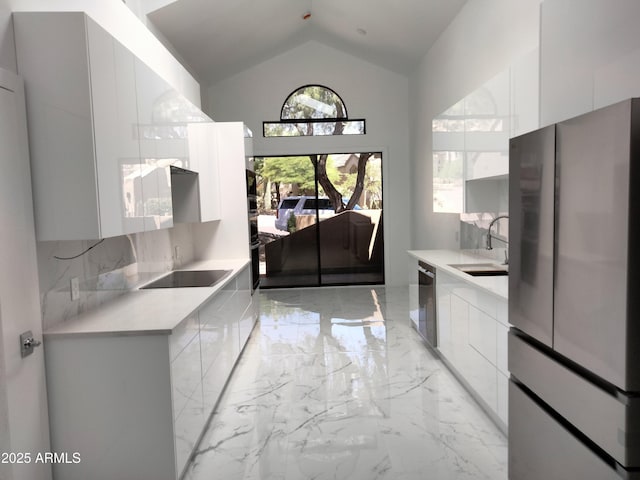 25150 N Windy Walk Dr Unit 14, Scottsdale, AZ 85255 - kitchen featuring modern cabinets, stainless steel appliances, light marble finish flooring, white cabinets, and light countertops