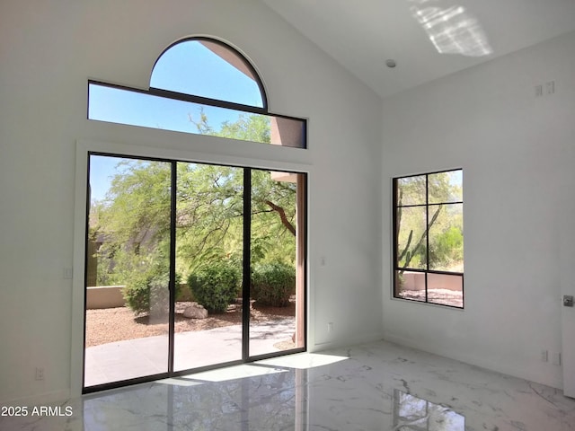 25150 N Windy Walk Dr Unit 14, Scottsdale, AZ 85255 - empty room with high vaulted ceiling and marble tiled flooring