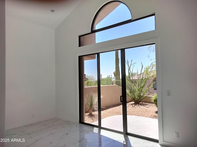 25150 N Windy Walk Dr Unit 14, Scottsdale, AZ 85255 - doorway to outside featuring marble finish floors and a towering ceiling