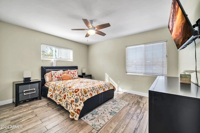 bedroom featuring light hardwood / wood-style floors and ceiling fan